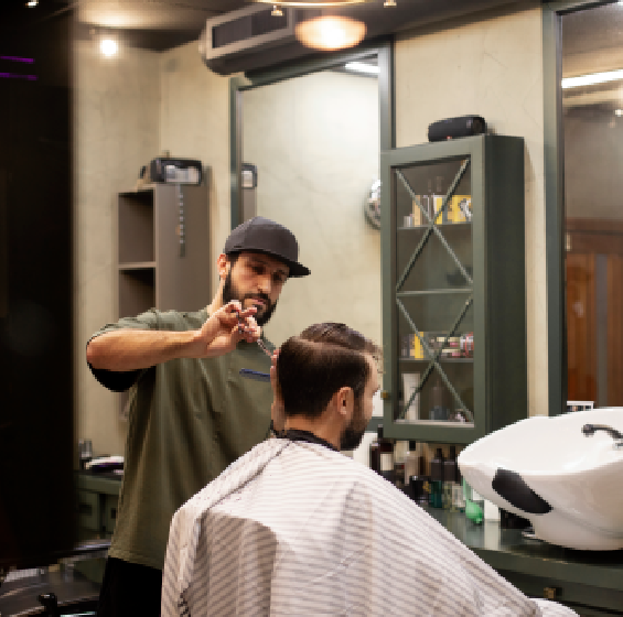 Professional barber providing a haircut near Katy TX